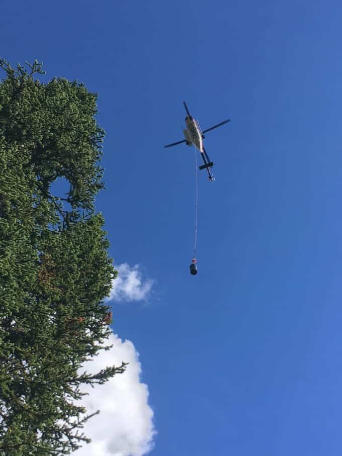 A helicopter delivers supplies to the tea house along the Plain of Six Glaciers trail in Banff National Park, Alberta.