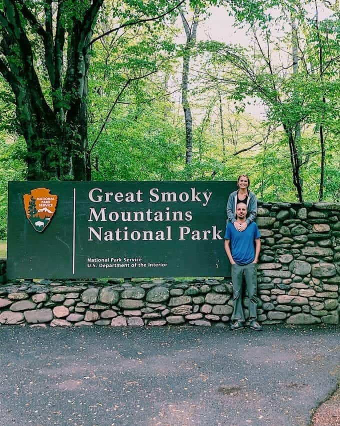 Standing by the sign at the beautiful entrance to Great Smoky Mountains National Park in North Carolina