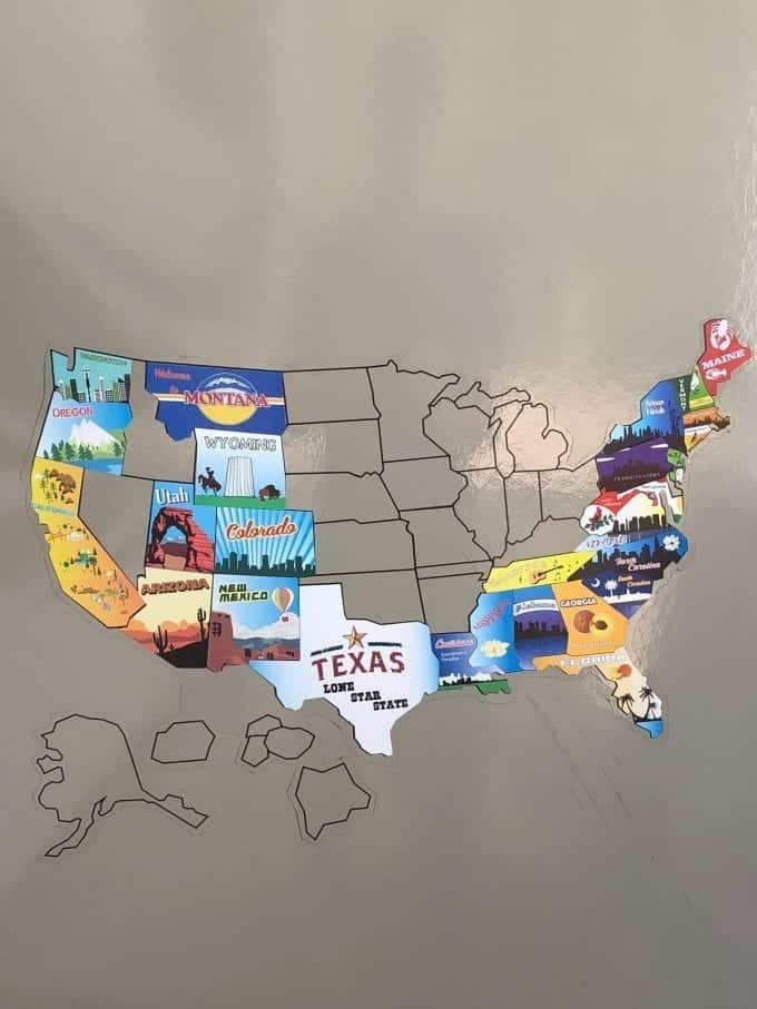 US map with stickers indicating which states an couple visited in their RV