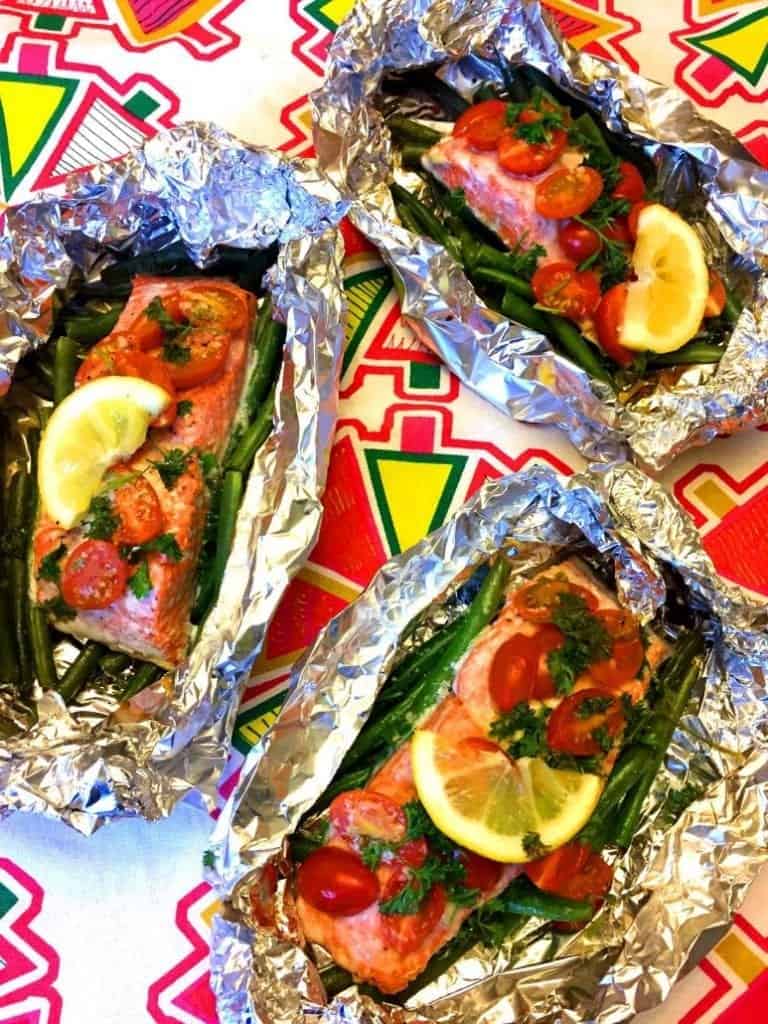 Salmon, lemon and seasoning inside foil packet for campfire