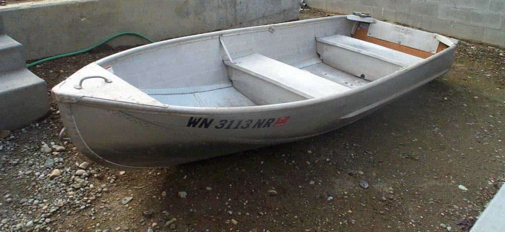 Small aluminum boat, similar to the one I lifted that fateful Sunday morning, that began my troubles with back pain.