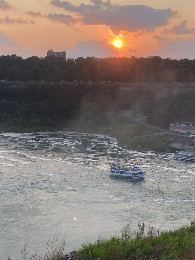 Maid of the Mist boat touring through the Niagara Gorge and giving visitors an up close and personal experience of American Falls, Bridal Veil Falls and Horseshoe Falls.