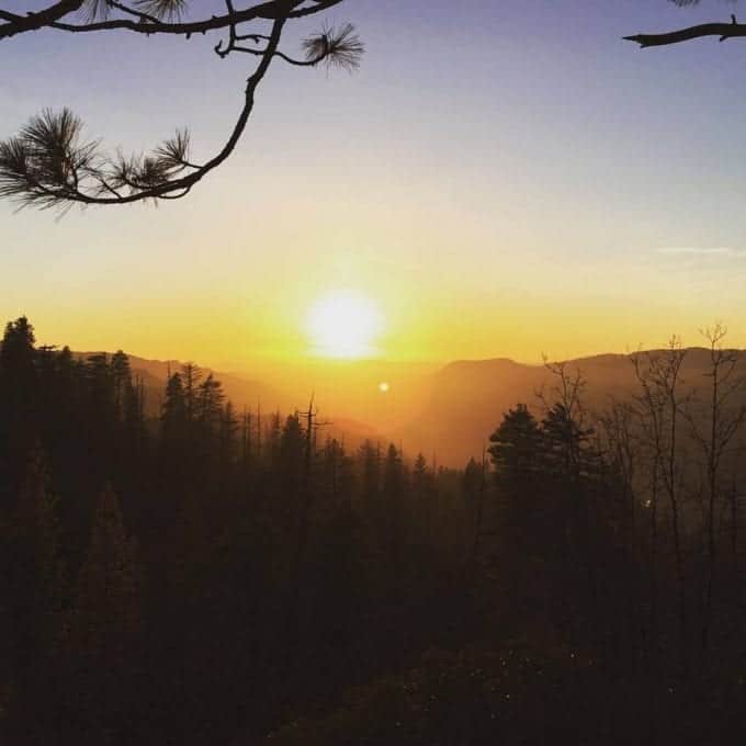 Sun setting over mountains at Yosemite National Park