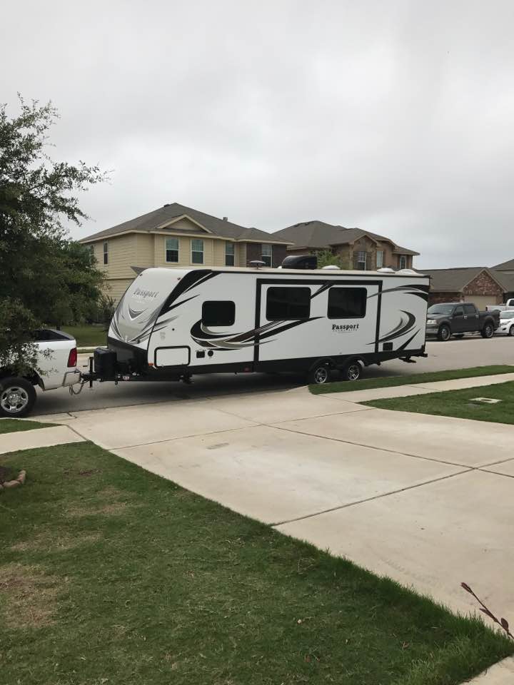 Travel trailer parked in front of house ready for next road trip