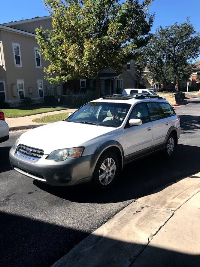 White car parked on street