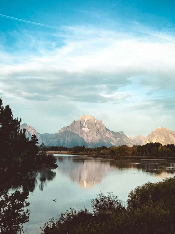 Calm lake and mountains seen within Grand Teton National Park