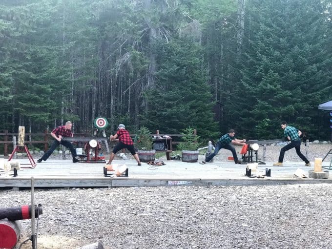 Four men participating in a lumberjack competition.