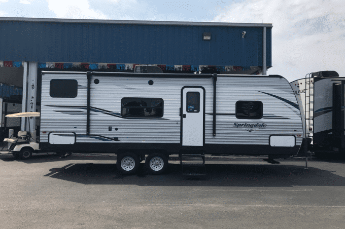 Exterior view of Keystone Springdale Travel Trailer parked at rental lot