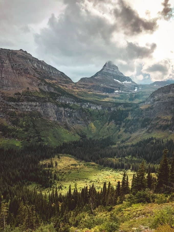 Sun shining on valley and mountains in Glacier National Park