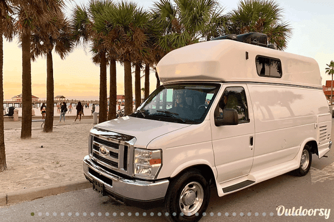 Camper van parked near beach is for rent