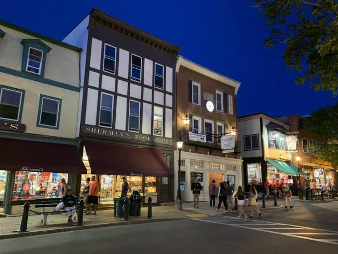 People crossing the street to shopping area near Acadia National Park in Maine