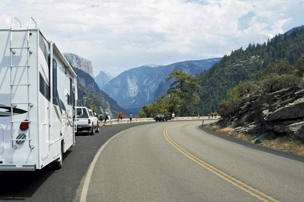 RVs parked and people sightseeing