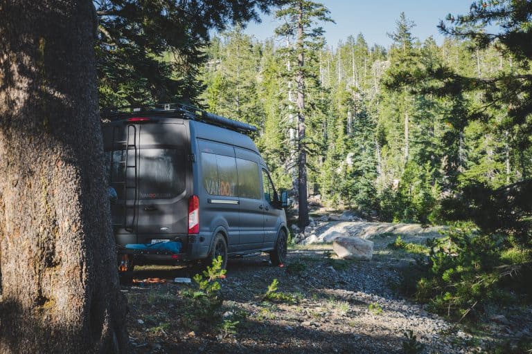 Black camper van parked outdoors