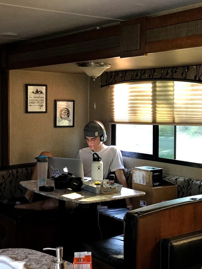 Teenage boy studying in RV