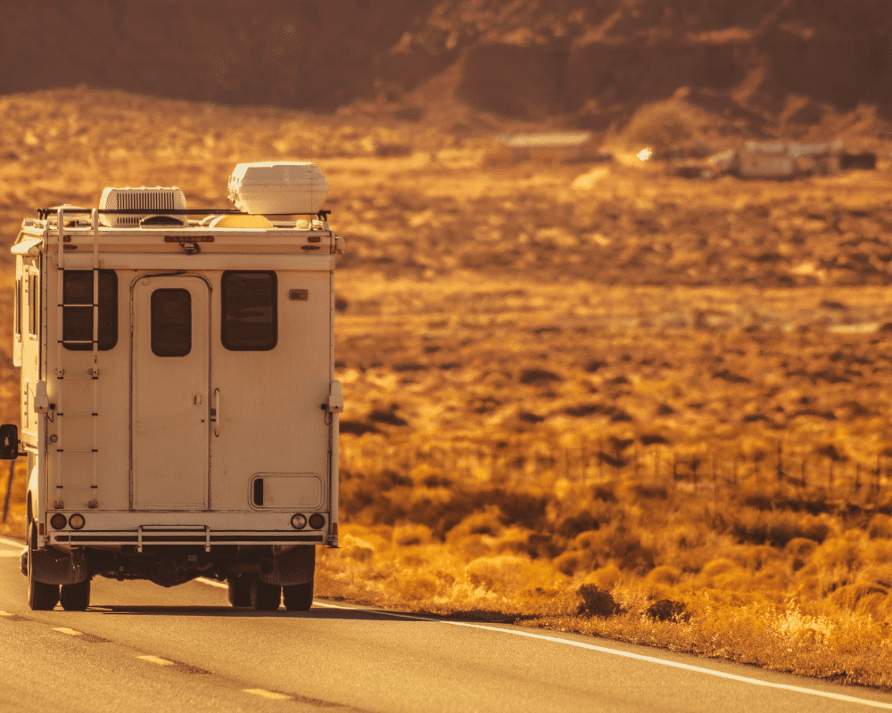 truck camper driving down the road