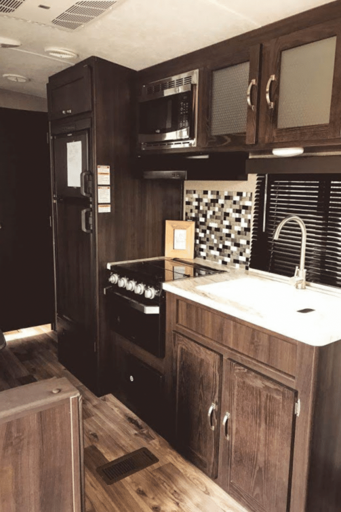 RV kitchen with small refrigerator