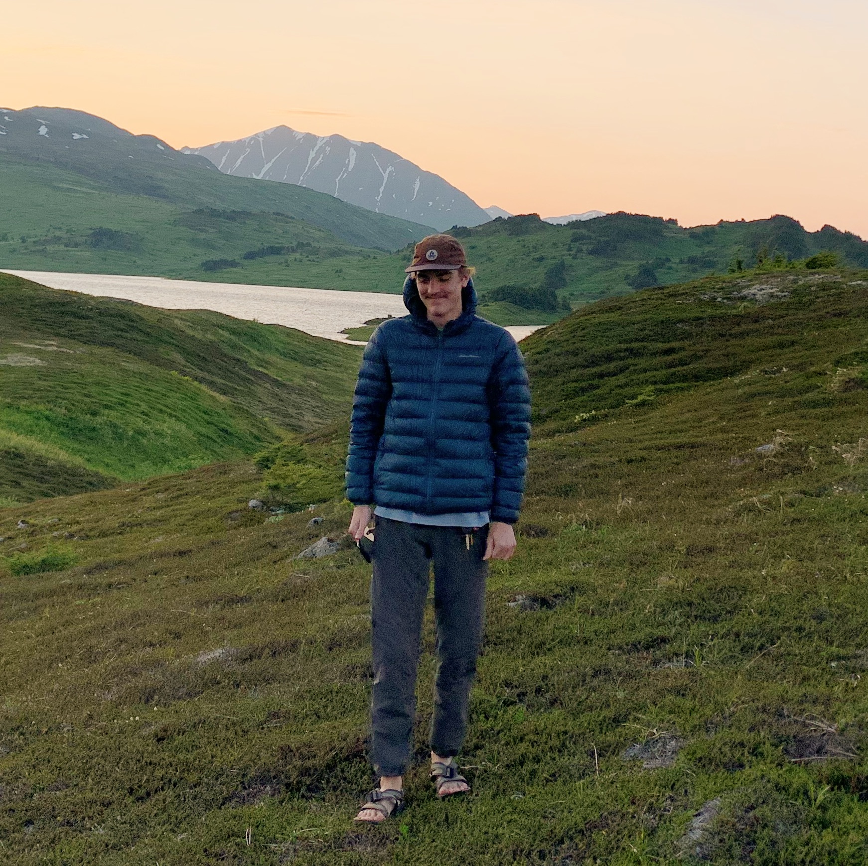 Young man in jacket on hiking trail