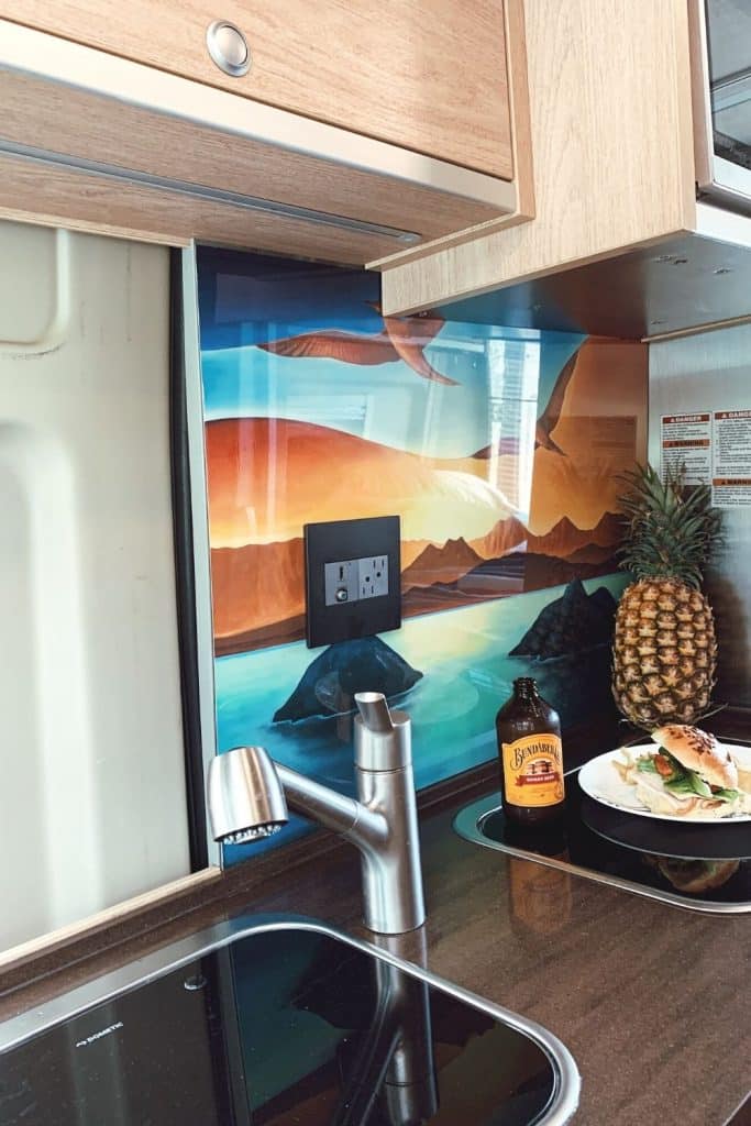 Meal on plate near sink in our campervan rental in Hawaii