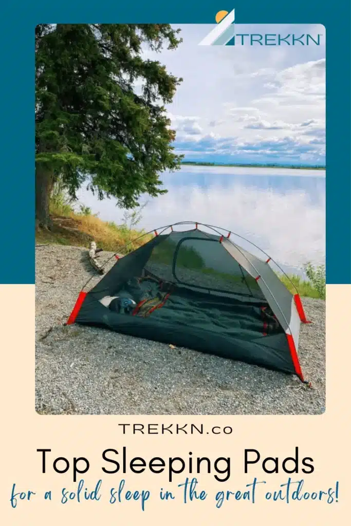 Tent pitched near lake with text "top sleeping bags for a solid sleep outdoors."