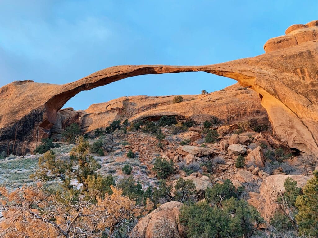 Arch rock formation with thin rock top seen while hiking Devil's Garden Trail