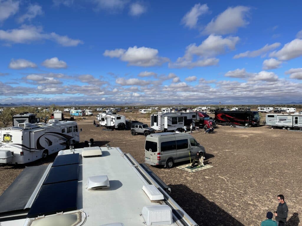 Many RVs and camper vans parked in boondocking remote area