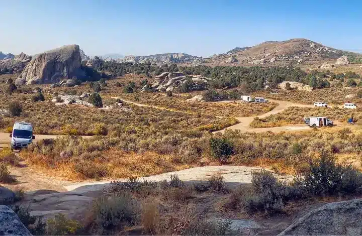 Wide open area with campervans and RVs boondocking