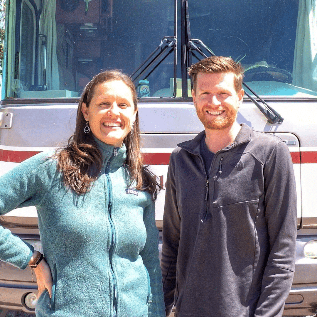 Man and woman in front of RV