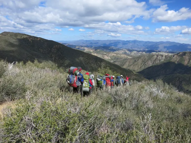 Group of hikers backpacking through San Rafael Wildnerness