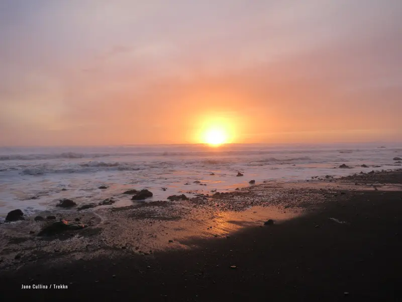 Sunset over ocean seen while hiking Lost Coast Trail.